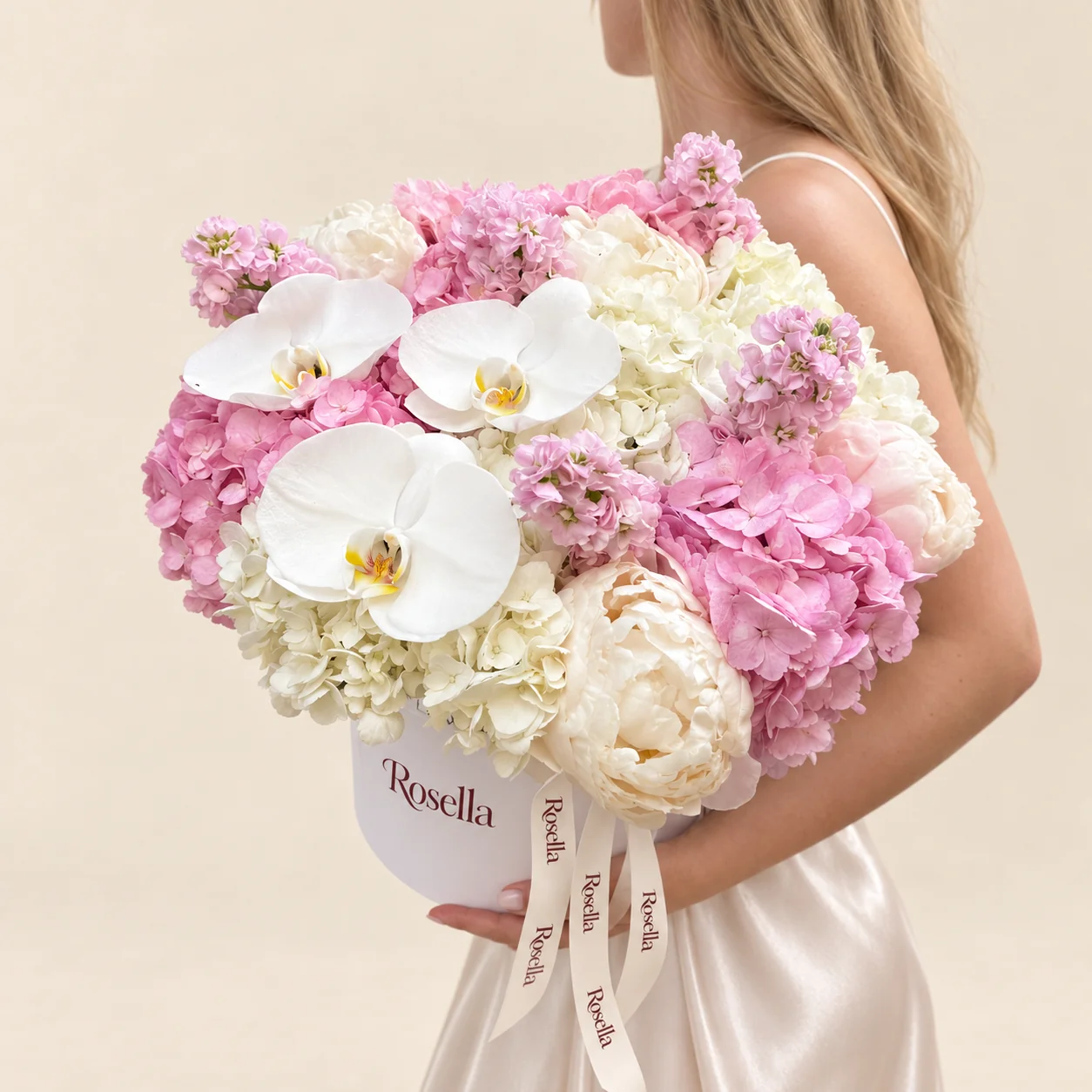 4 pink hydrangeas, 4 white hydrangeas, 4 ivory peonies, 4 stocks, 2 pink peonies & 3 orchid blooms in a round box