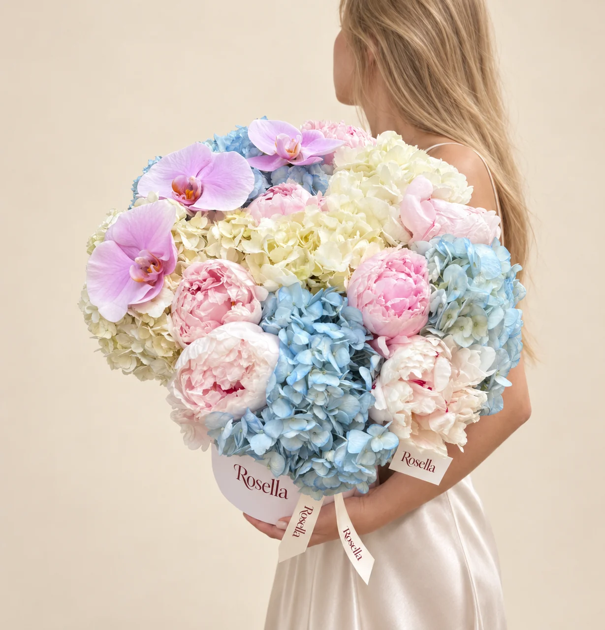 5 blue hydrangeas, 9 peonies, 4 cream hydrangeas & 4 orchid blooms in a round box
