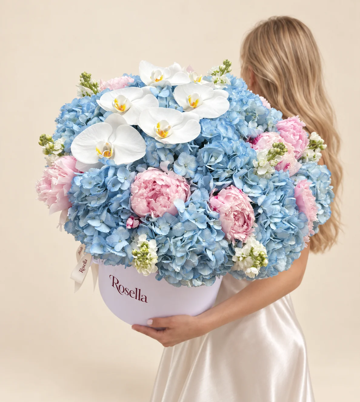 12 hydrangeas, 11 peonies, 4 stocks & 6 orchid blooms in a round box