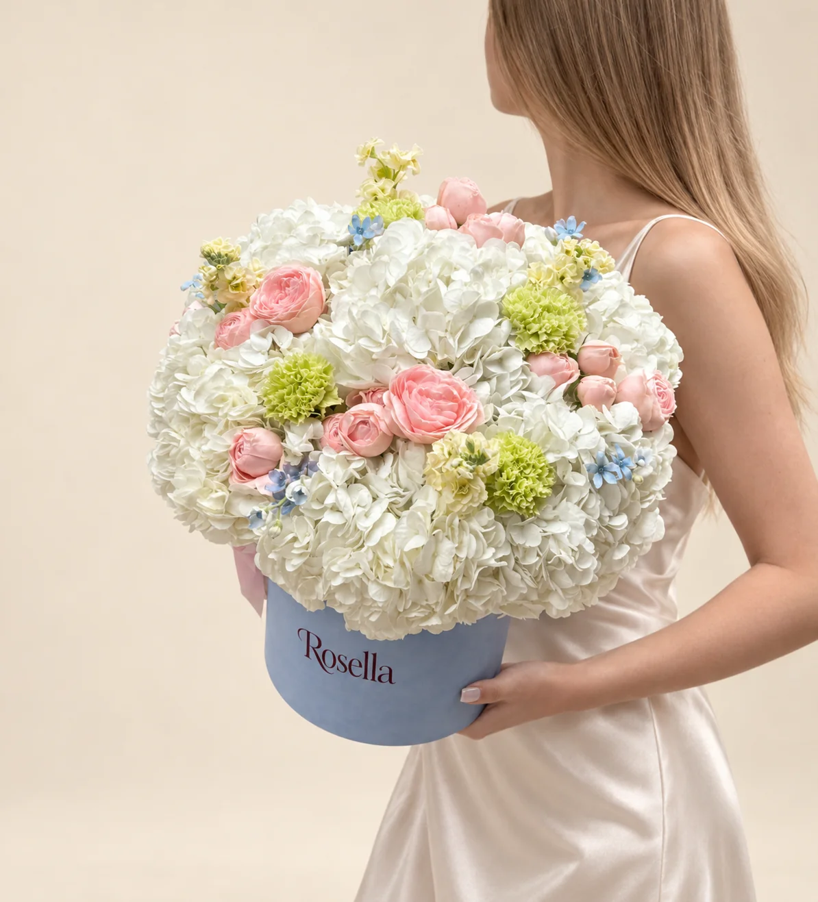 11 hydrangeas, 21 spray roses, 3 stocks, 5 carnations & 18 tweedia blooms in a round box