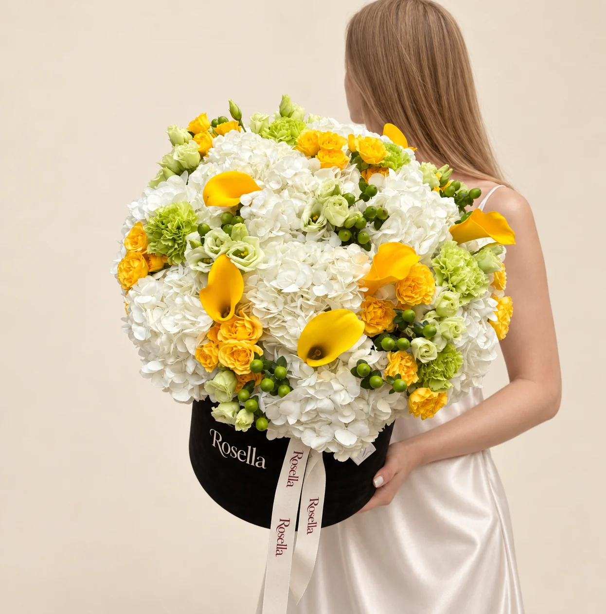 13 hydrangeas, 30 spray roses, 33 lisianthus blooms, 8 carnations & 7 callas in a round box