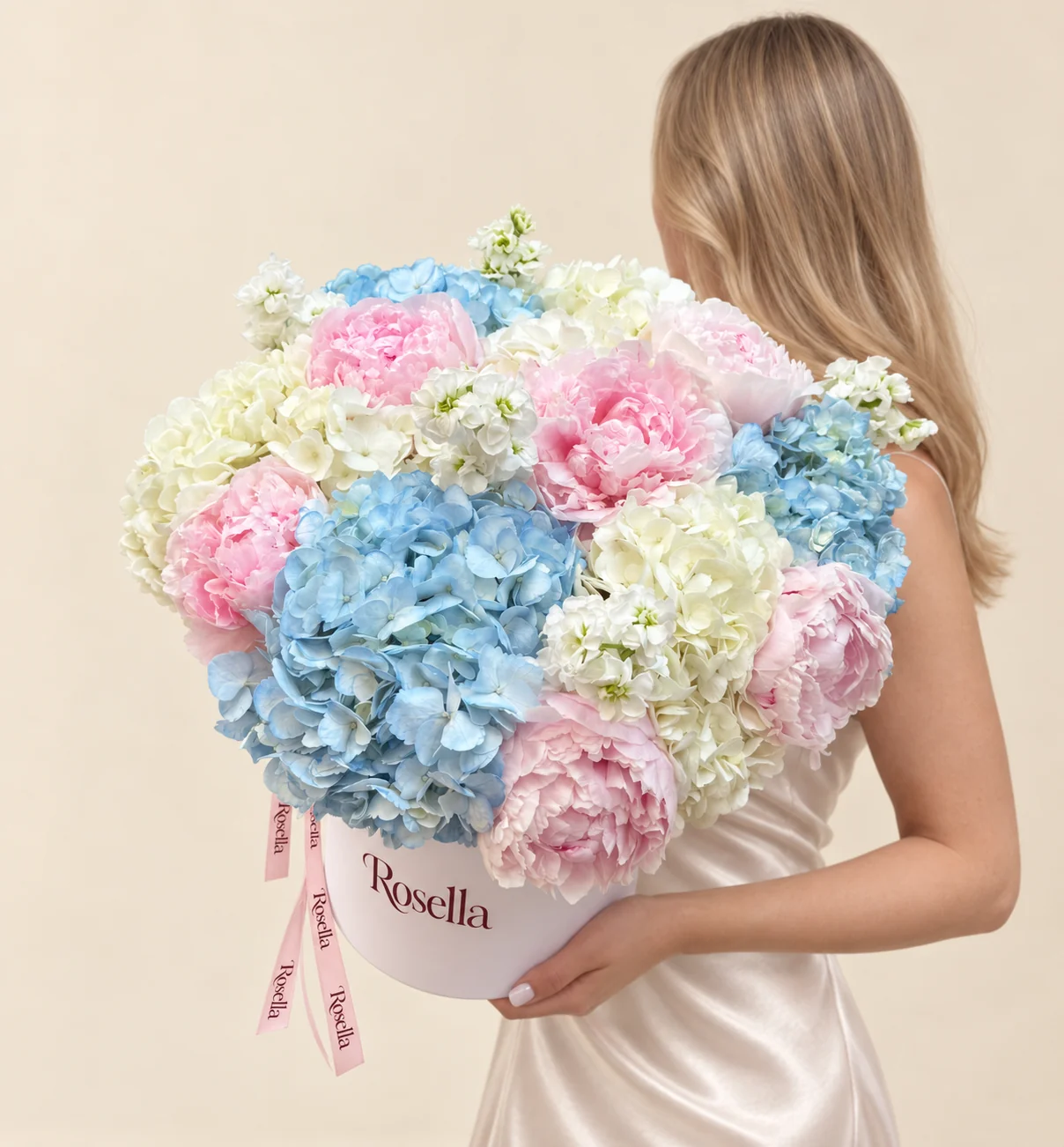 8 peonies, 4 blue hydrangeas, 4 ivory hydrangeas & 4 stocks in a round box