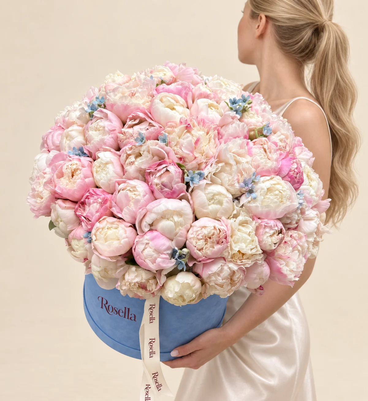 47 pink peonies, 20 ivory peonies & 36 tweedia blooms in a round box