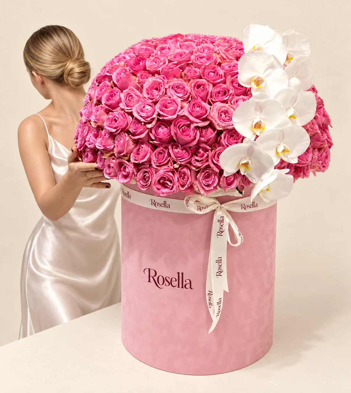 115 roses & 8 orchid blooms in a round box
