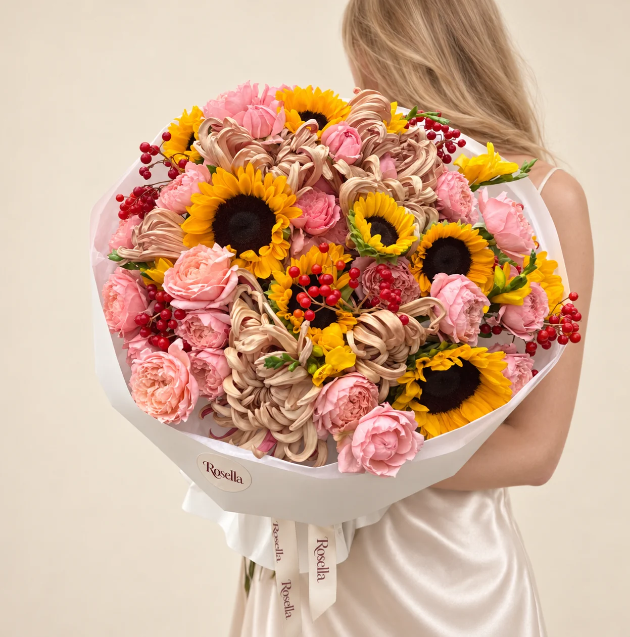 11 chrysanthemums, 10 sunflowers, 27 spray roses & 5 freesias in a hand-tied bouquet