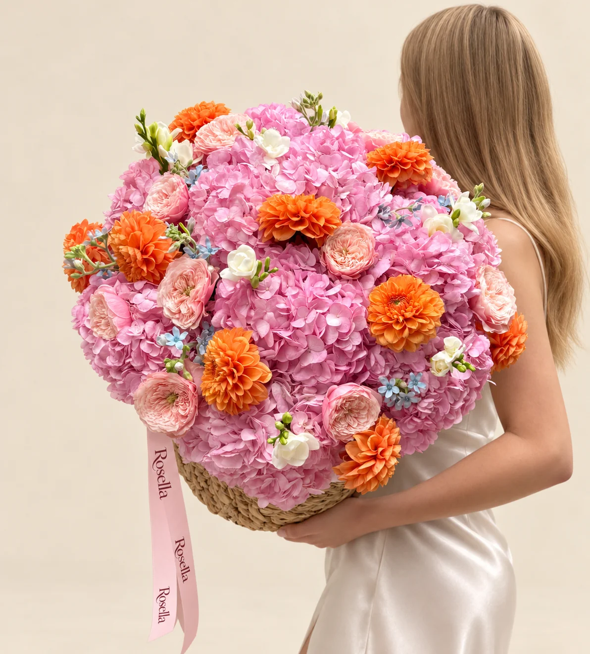 15 hydrangeas, 11 garden roses, 11 dahlias, 25 tweedia blooms & 4 freesias in a basket