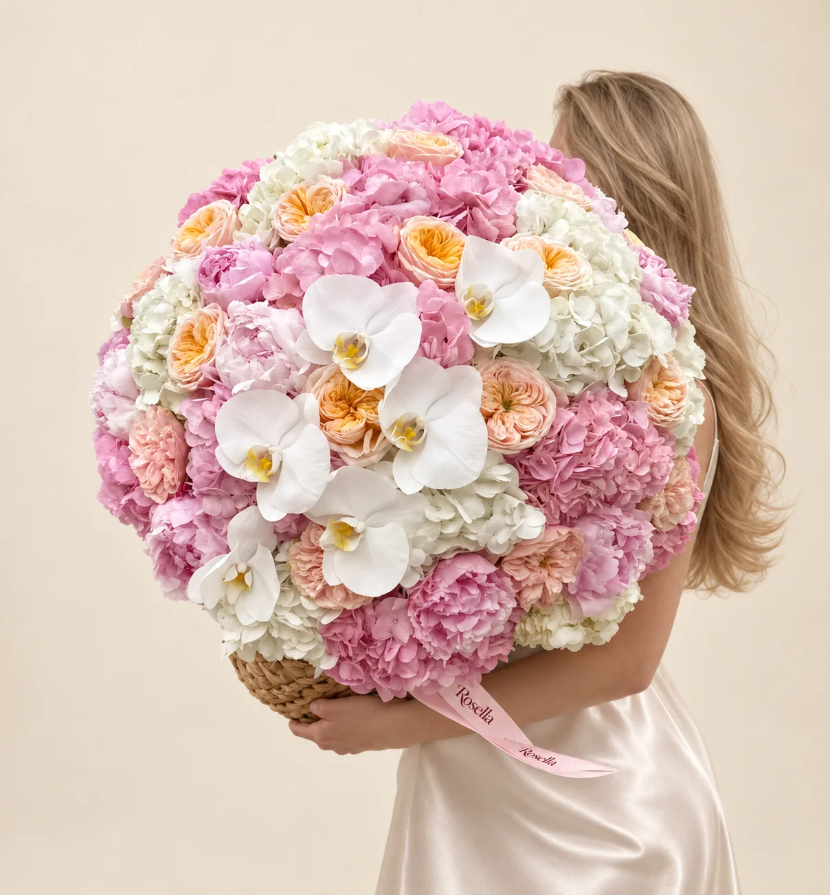 13 pink hydrangeas, 10 white hydrangeas, 10 peonies, 9 cream garden roses, 8 blush garden roses & 6 orchid blooms in a basket