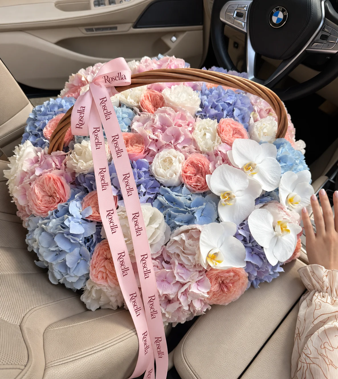 8 pink hydrangeas, 6 blue hydrangeas, 11 white peonies, 13 garden roses, 4 lavender hydrangeas, 3 blush peonies & 5 orchid blooms in a basket