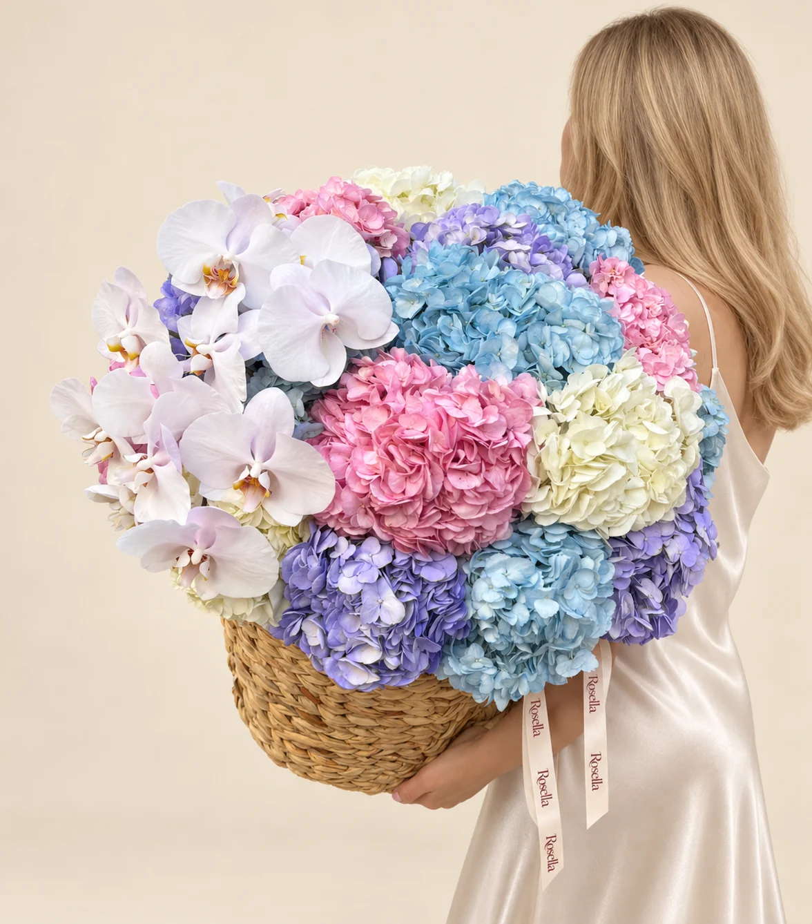 7 blue hydrangeas, 5 pink hydrangeas, 5 lavender hydrangeas, 4 cream hydrangeas & 11 orchid blooms in a basket