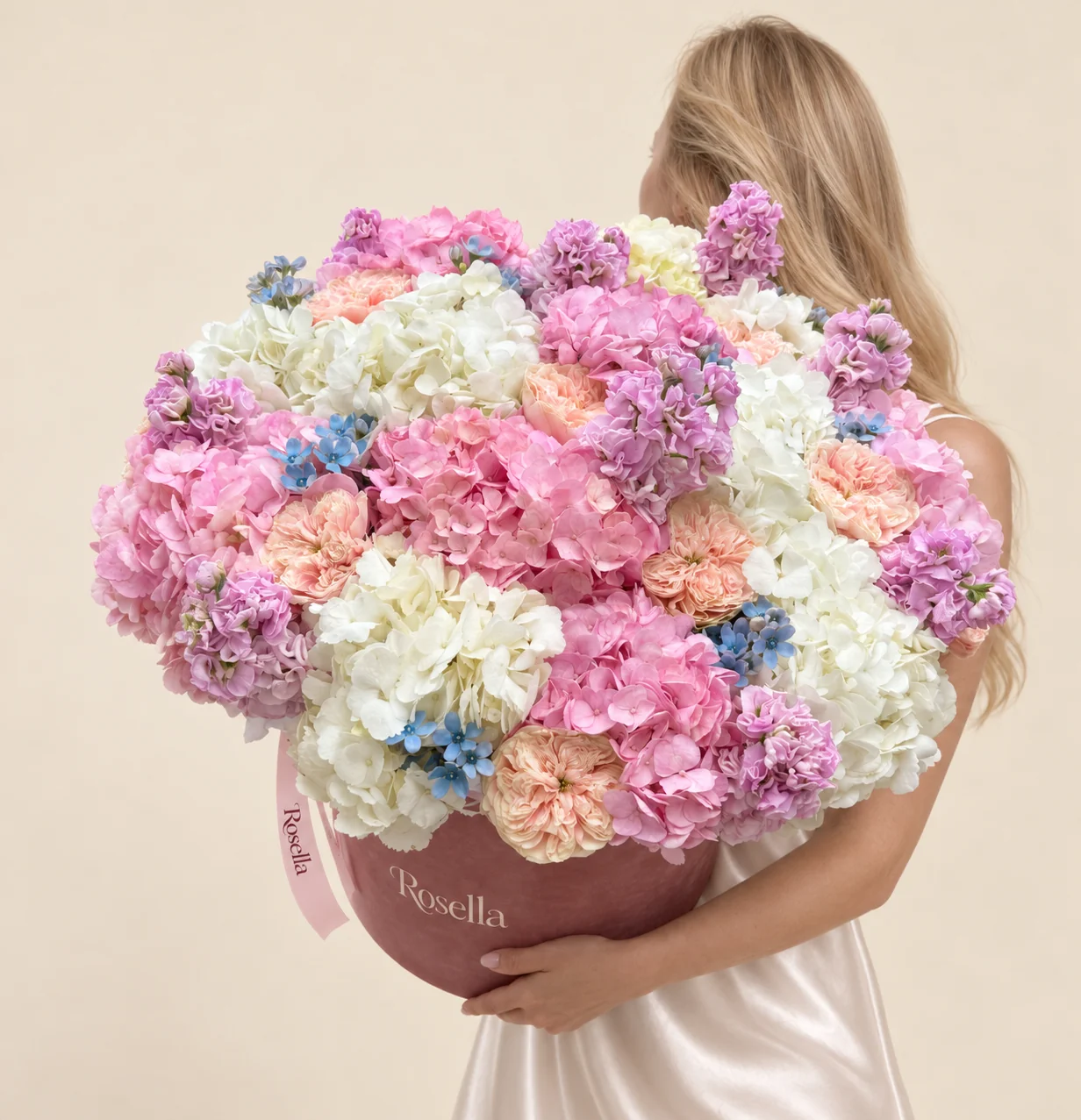 9 pink hydrangeas, 9 white hydrangeas, 10 garden roses, 7 stocks & 40 tweedia blooms in a round box