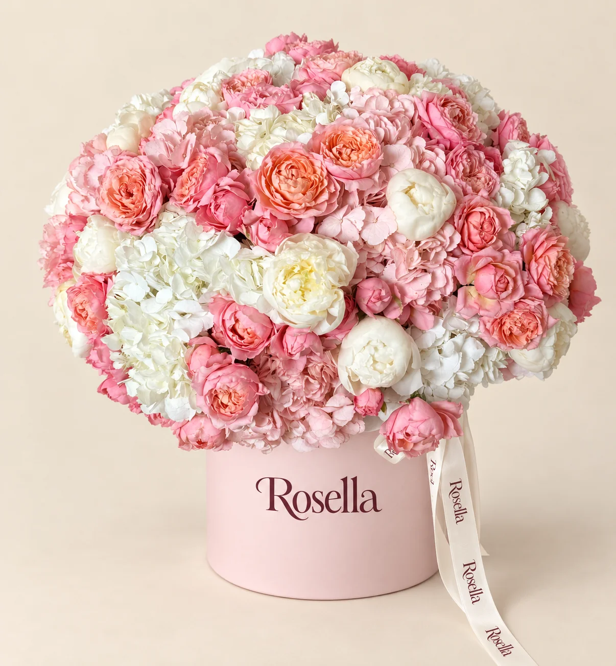 9 white hydrangeas, 6 pink hydrangeas, 47 pink spray roses & 14 ivory spray roses in a round box