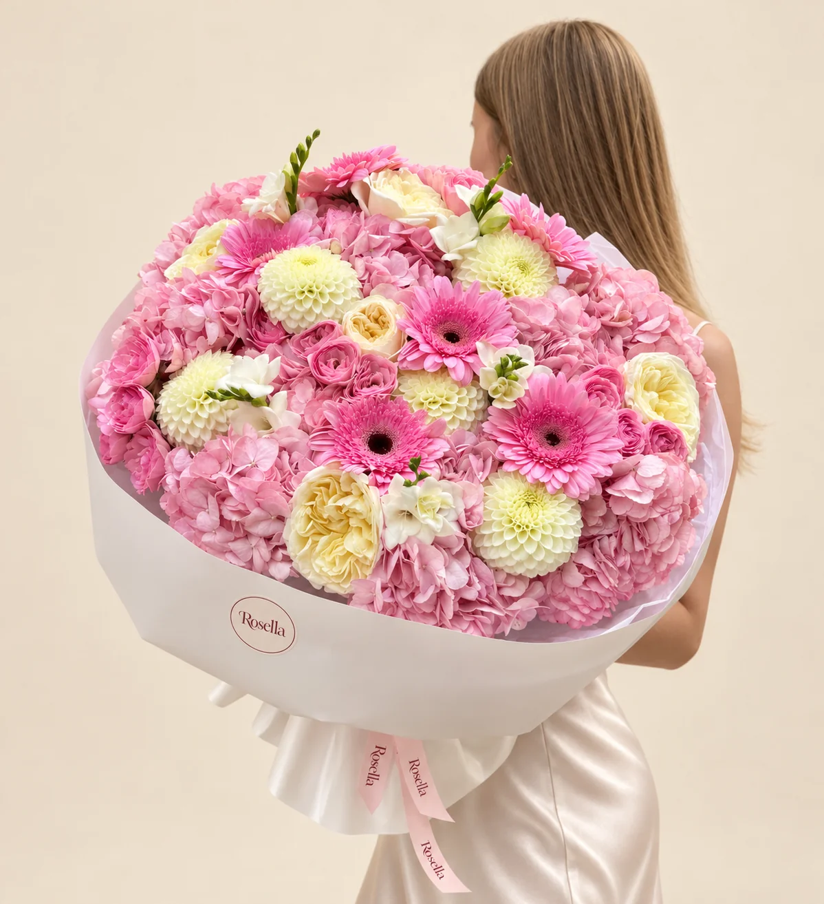 10 hydrangeas, 6 garden roses, 5 dahlias, 8 gerberas, 16 spray roses & 5 freesias in a hand-tied bouquet