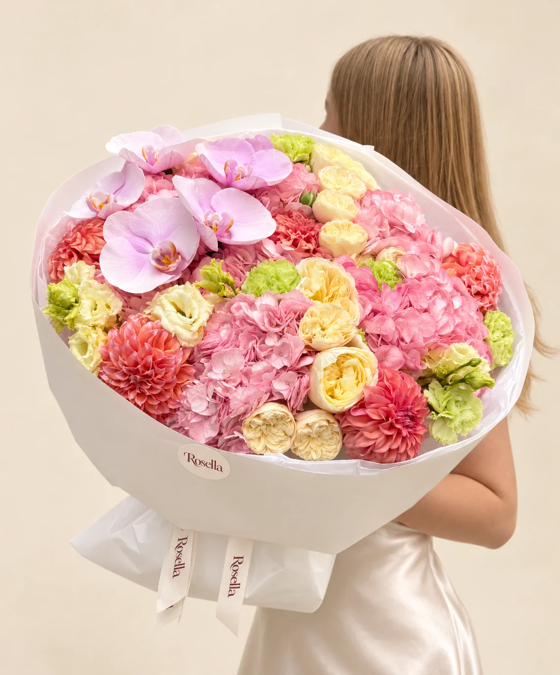 6 hydrangeas, 12 garden roses, 6 dahlias, 5 orchid blooms, 9 green lisianthus blooms & 6 cream lisianthus blooms in a hand-tied bouquet
