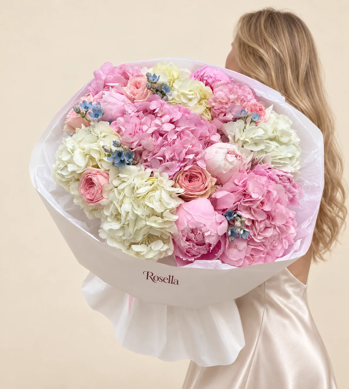 5 pink hydrangeas, 4 white hydrangeas, 6 garden roses, 3 pink peonies, 16 tweedia blooms & 1 blush peony in a hand-tied bouquet