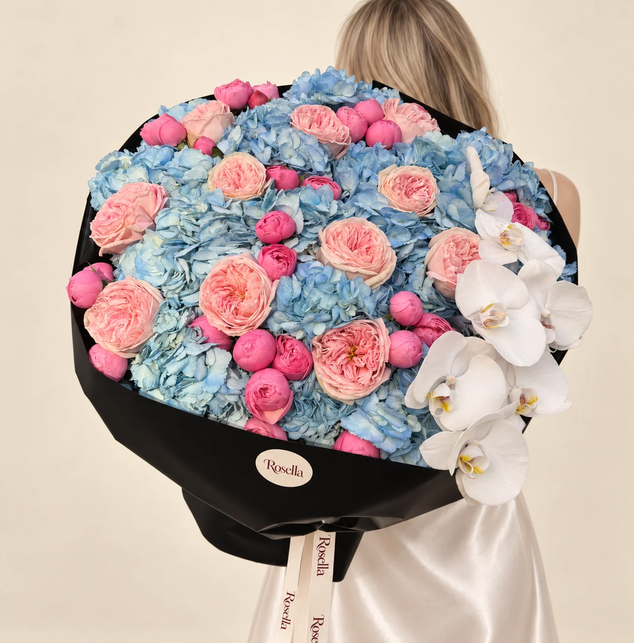 15 hydrangeas, 13 garden roses, 30 spray roses & 7 orchid blooms in a hand-tied bouquet