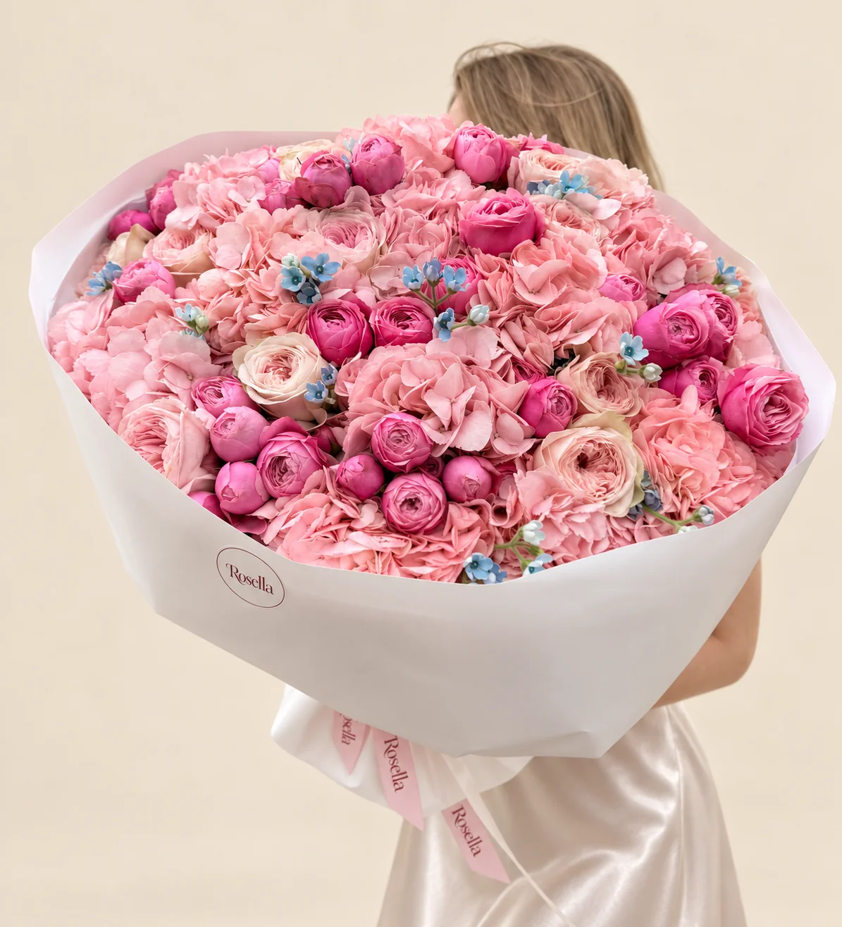 14 hydrangeas, 11 garden roses, 36 spray roses & 33 tweedia blooms in a hand-tied bouquet