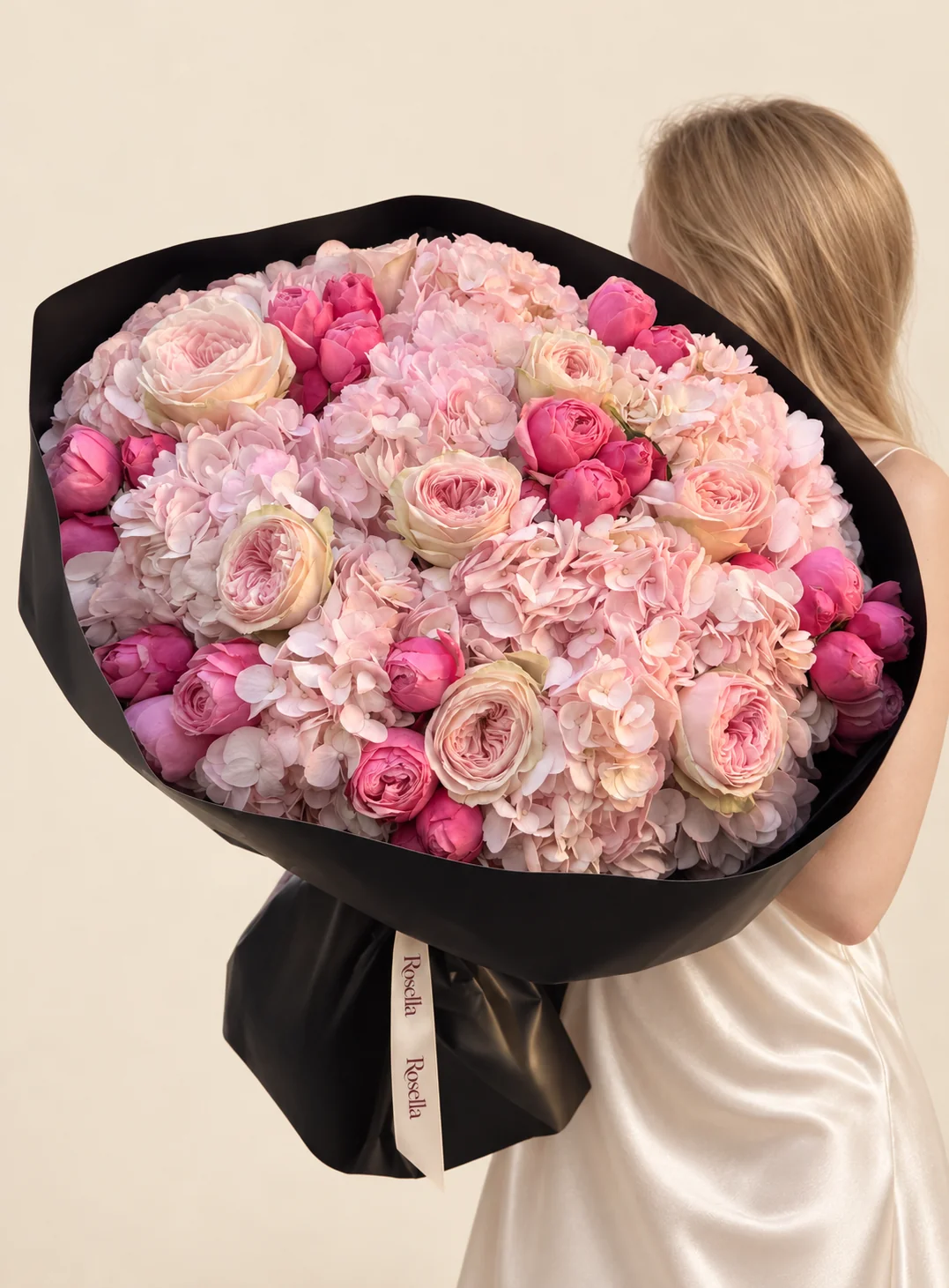8 hydrangeas, 10 garden roses & 30 spray roses in a hand-tied bouquet