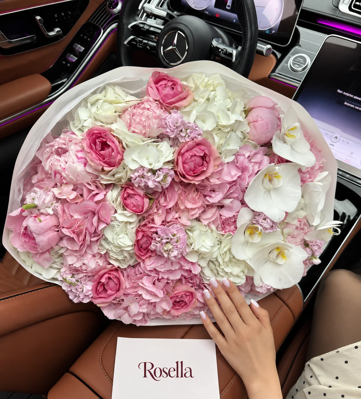 7 white hydrangeas, 6 pink hydrangeas, 8 peonies, 9 garden roses, 4 stocks & 6 orchid blooms in a hand-tied bouquet