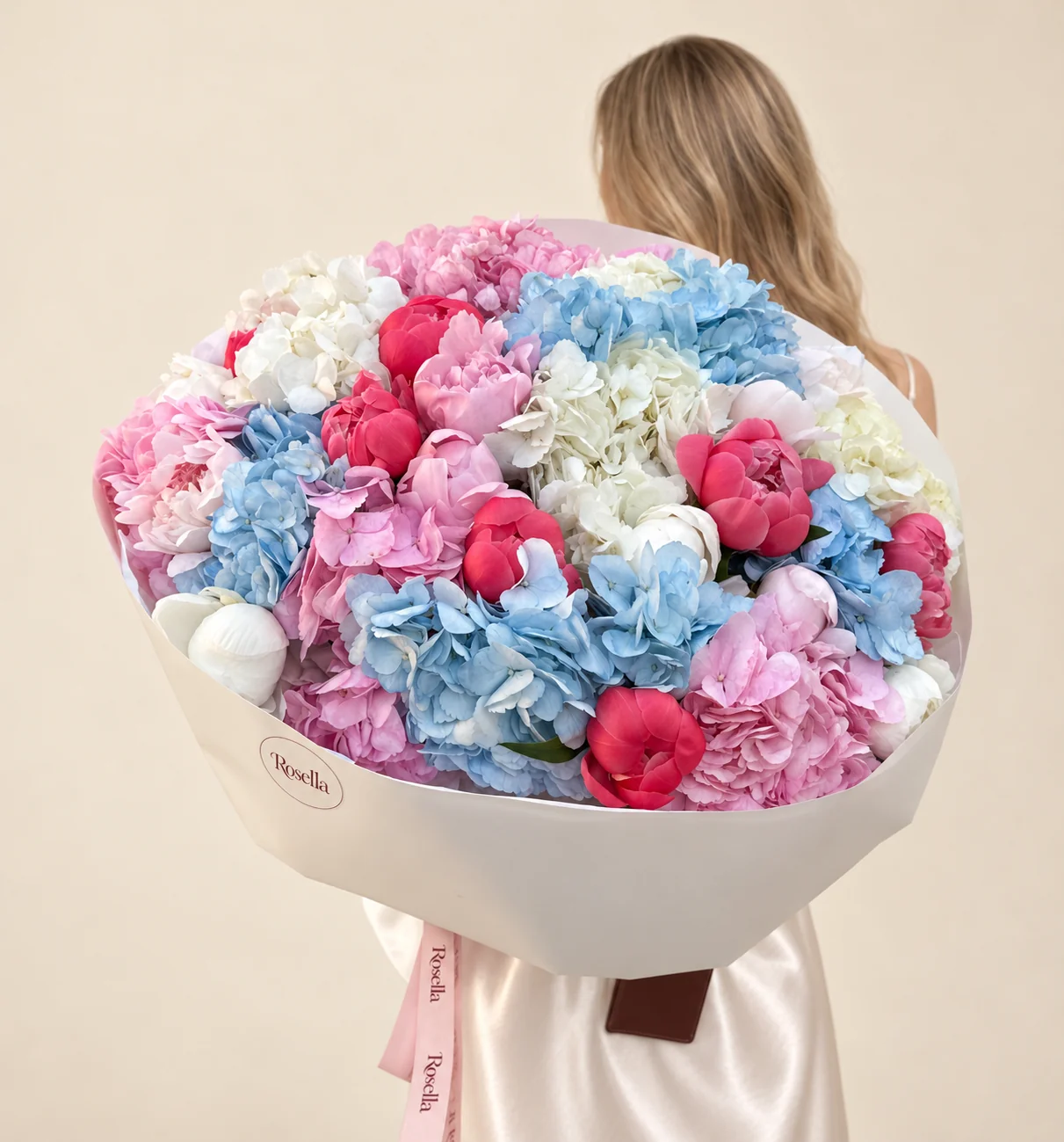 6 blue hydrangeas, 10 coral peonies, 5 pink hydrangeas, 5 white hydrangeas, 6 pink peonies & 6 white peonies in a hand-tied bouquet