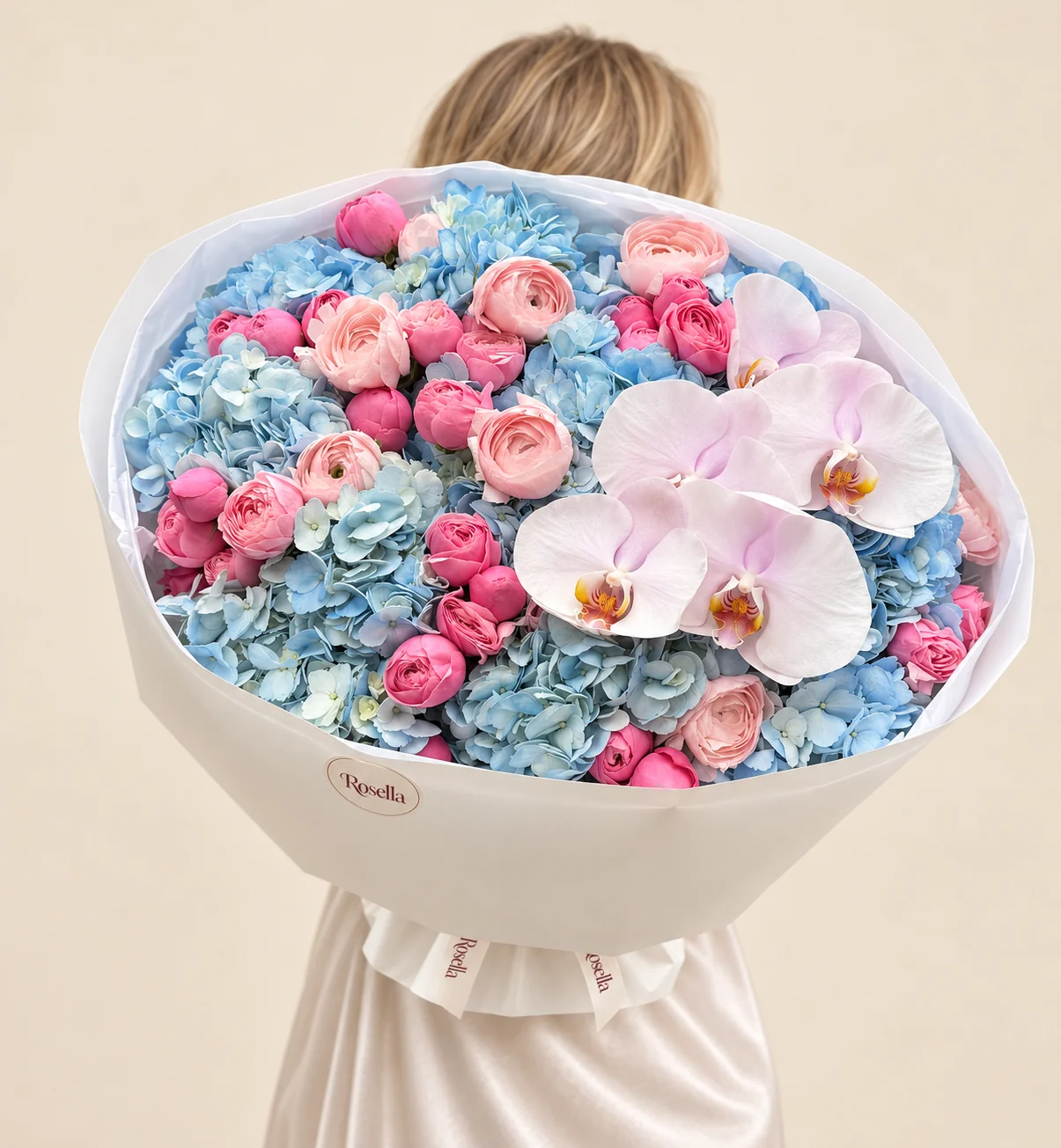 11 hydrangeas, 30 pink ranunculus, 9 blush ranunculus & 5 orchid blooms in a hand-tied bouquet