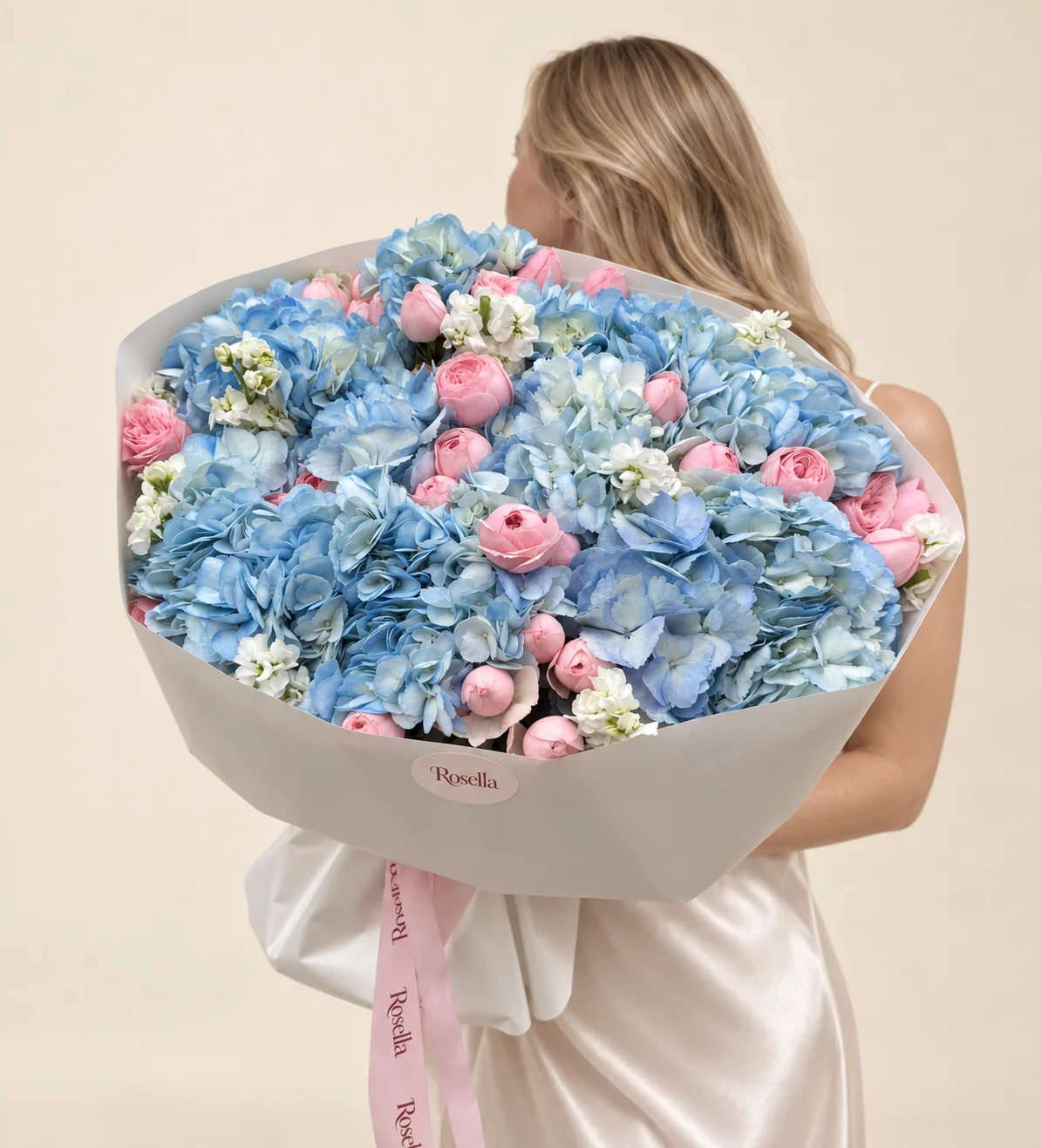 13 hydrangeas, 33 spray roses & 4 stocks in a hand-tied bouquet