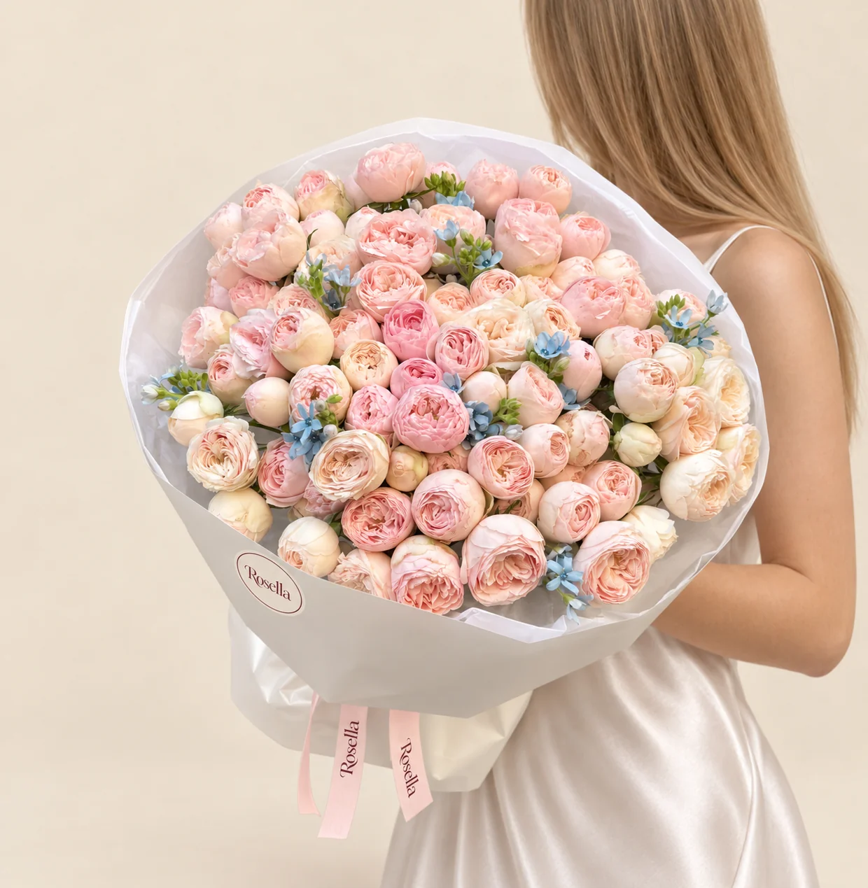 90 spray roses & 30 tweedia blooms in a hand-tied bouquet