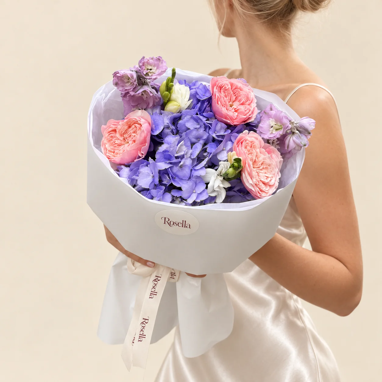 3 garden roses, 1 hydrangea, 1 delphinium & 2 freesias in a hand-tied bouquet