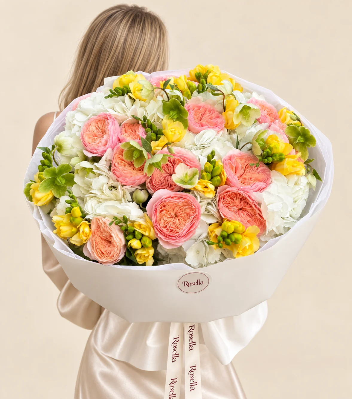 15 garden roses, 6 hydrangeas, 10 freesias & 15 hellebore in a hand-tied bouquet