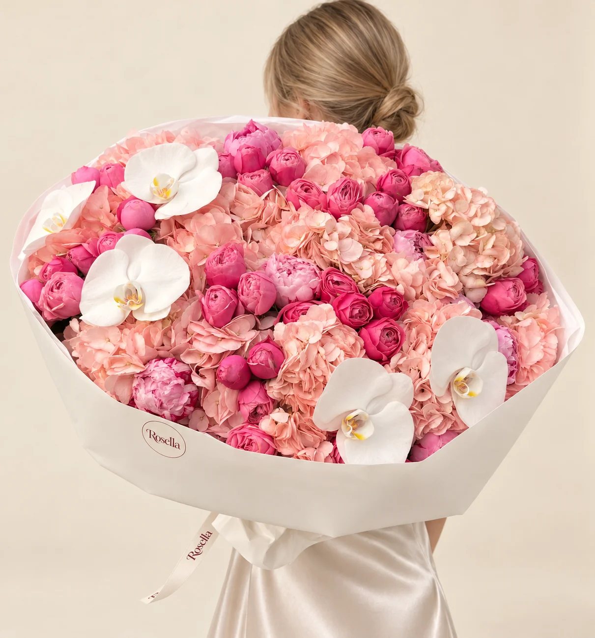 38 garden roses, 13 hydrangeas, 6 peonies & 5 orchid blooms in a hand-tied bouquet