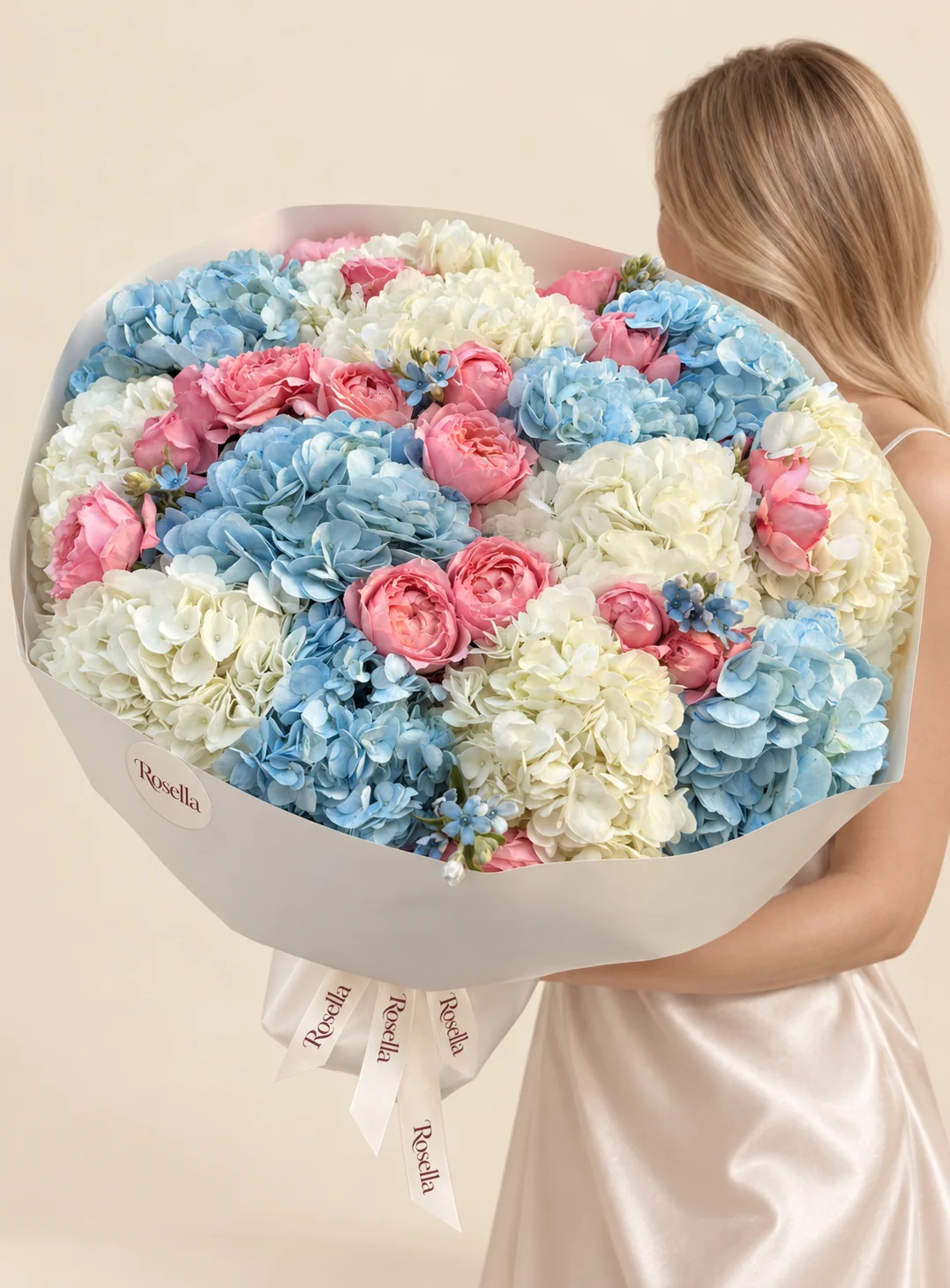 23 garden roses, 8 white hydrangeas, 7 blue hydrangeas & 20 tweedia blooms in a hand-tied bouquet