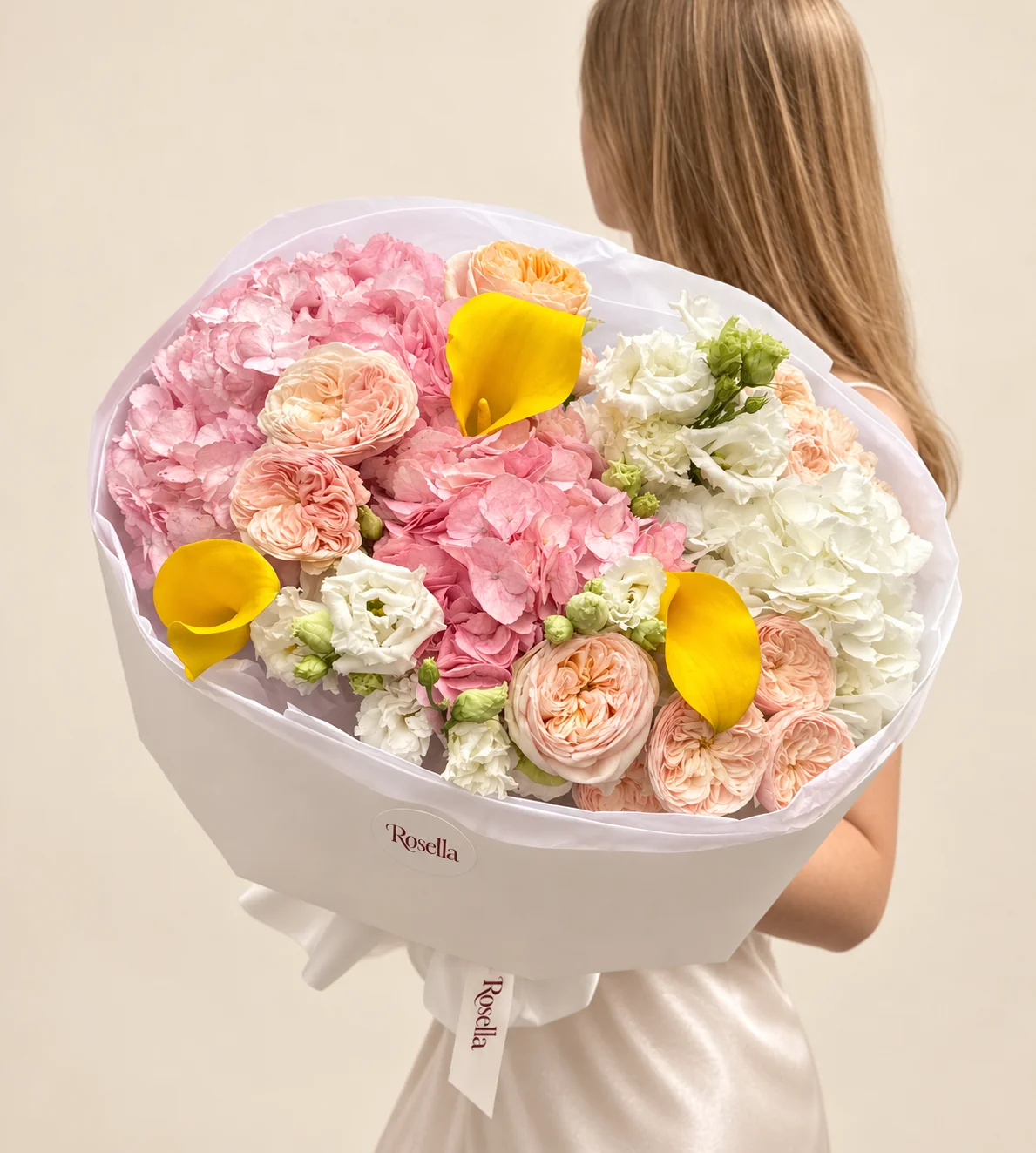 13 garden roses, 2 pink hydrangeas, 1 white hydrangea, 12 lisianthus blooms & 3 callas in a hand-tied bouquet