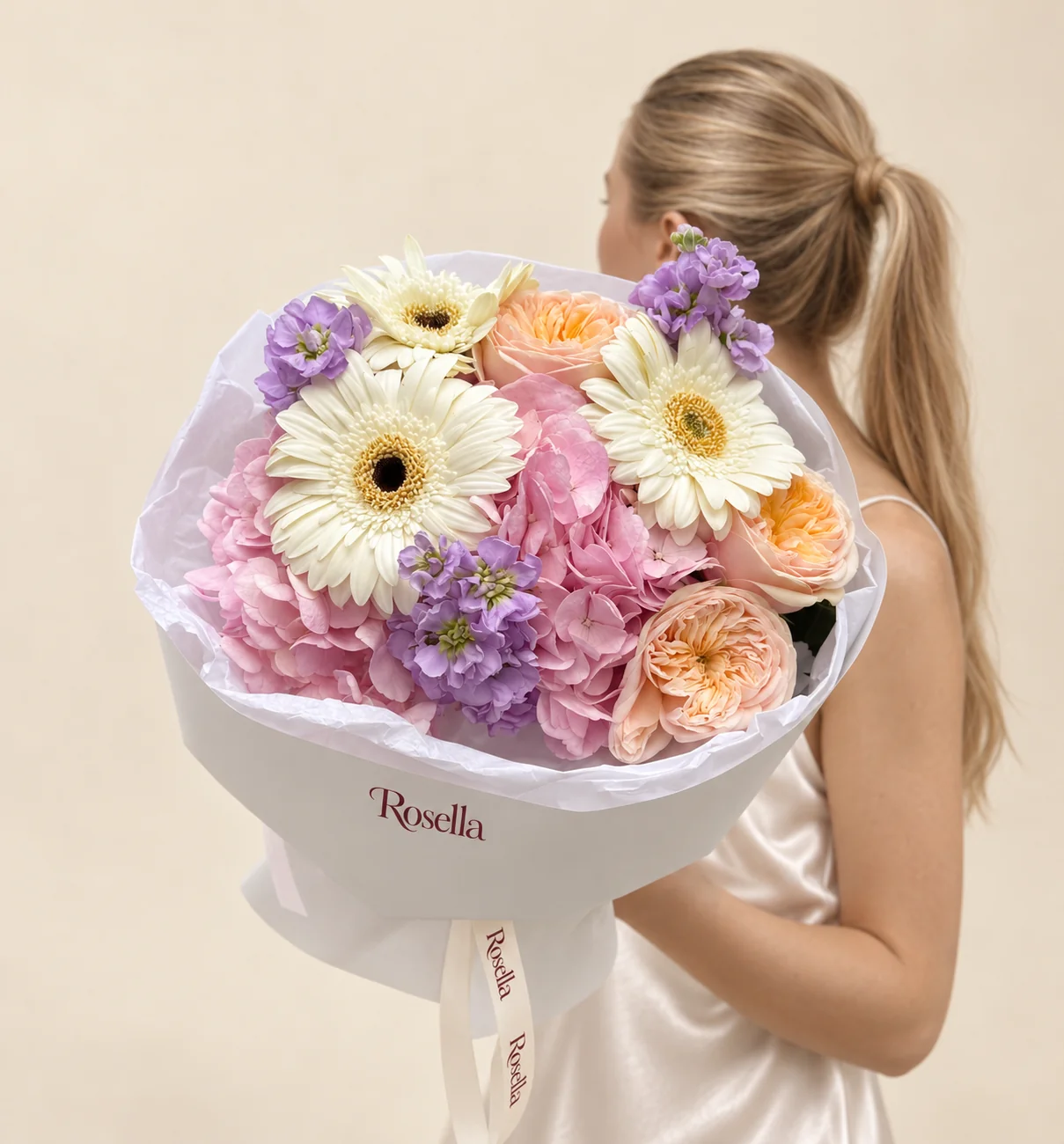 3 garden roses, 1 hydrangea, 2 stocks & 3 gerberas in a hand-tied bouquet