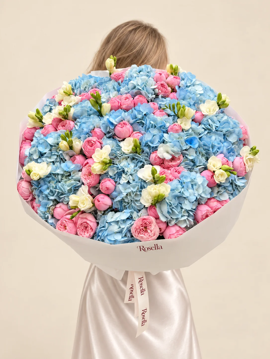 64 garden roses, 20 hydrangeas & 11 freesias in a hand-tied bouquet
