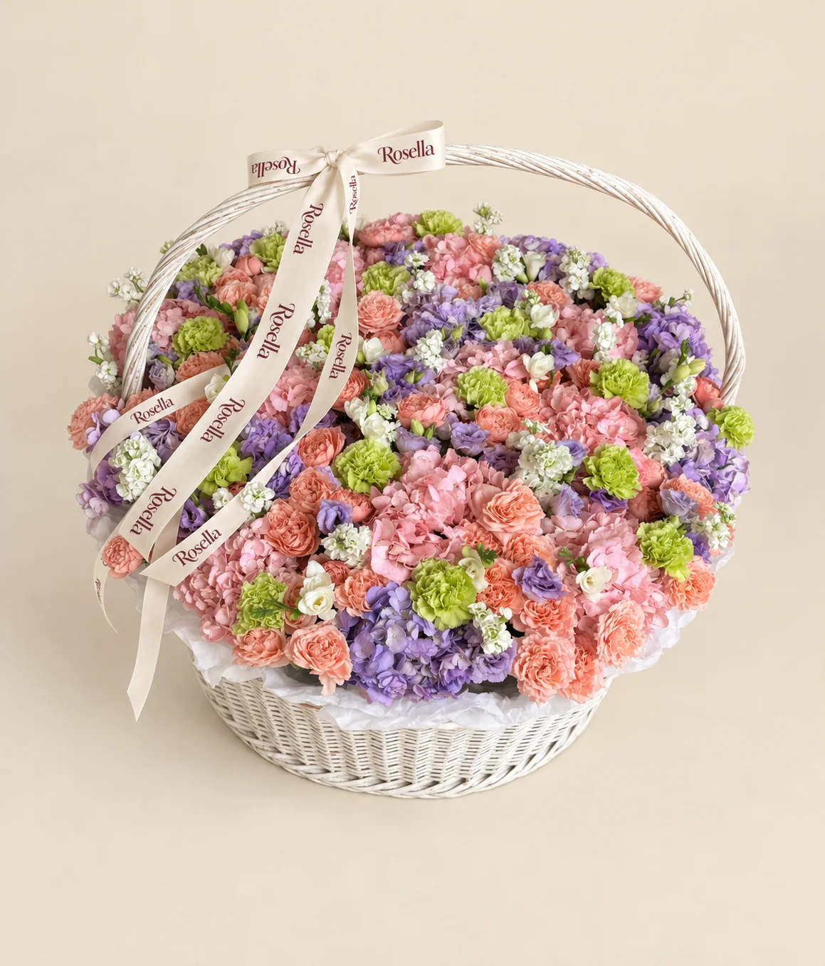 54 garden roses, 15 pink hydrangeas, 12 lavender hydrangeas, 21 carnations, 7 stocks, 23 lisianthus blooms & 6 freesias in a basket