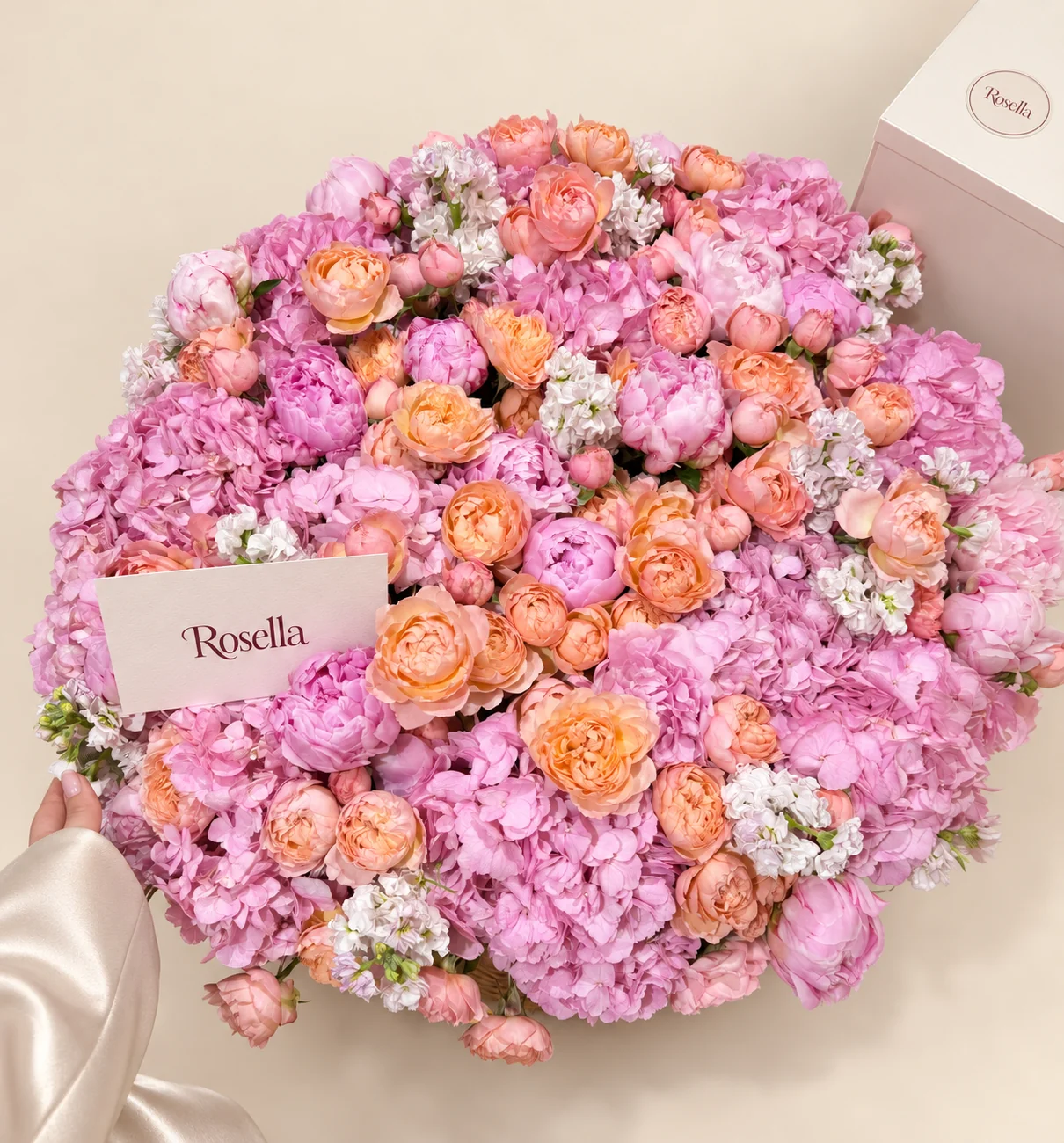 21 hydrangeas, 25 garden roses, 47 spray roses, 10 pink peonies, 10 stocks & 6 blush peonies in a basket
