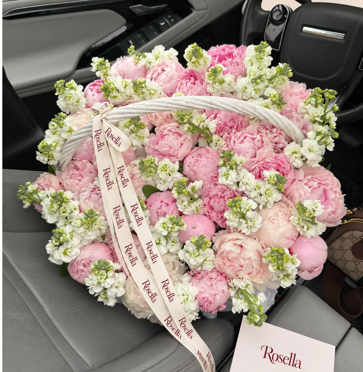 33 pink peonies, 20 stocks & 7 cream peonies in a basket