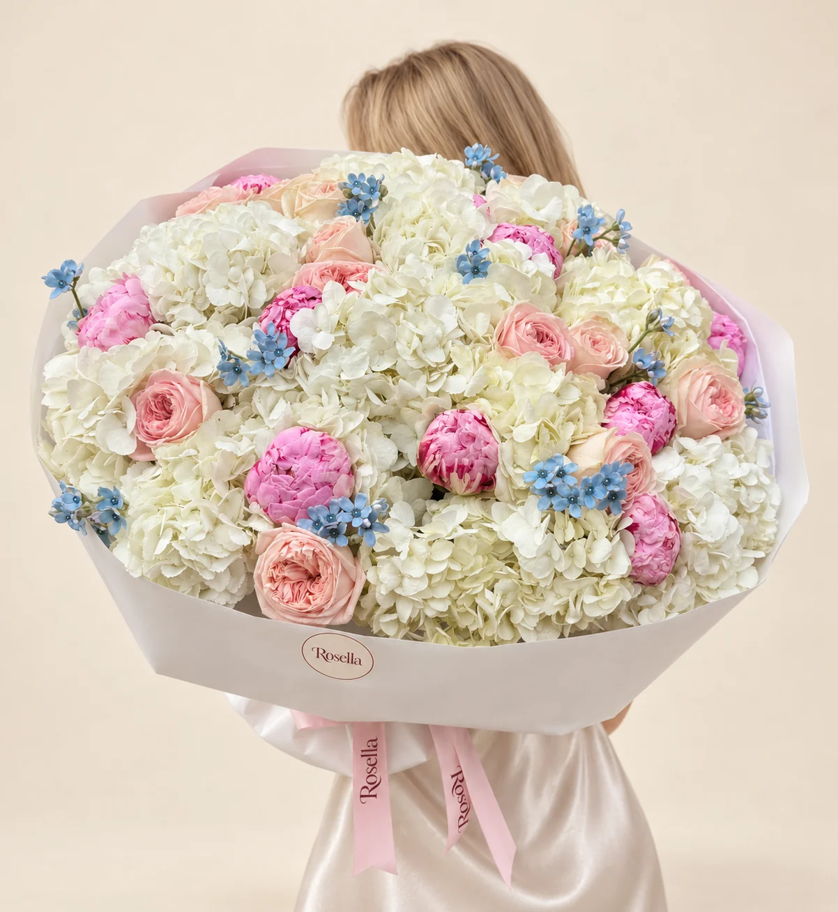 15 hydrangeas, 12 peonies, 13 garden roses & 65 tweedia blooms in a hand-tied bouquet