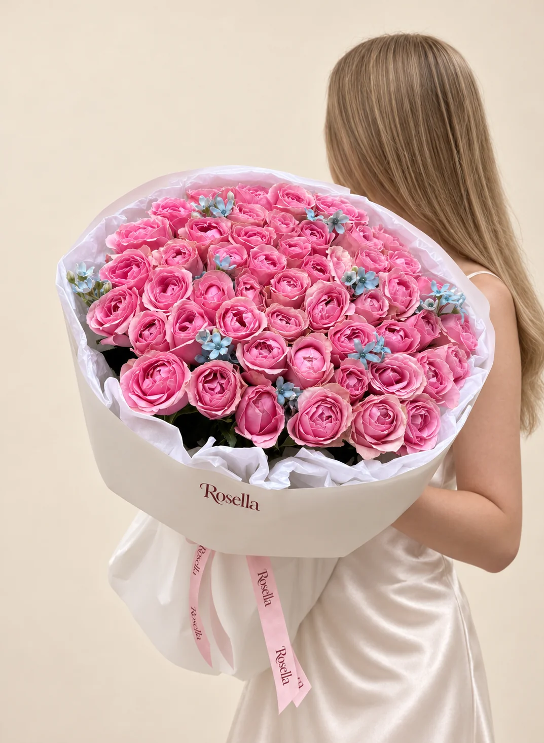 58 roses & 23 tweedia blooms in a hand-tied bouquet