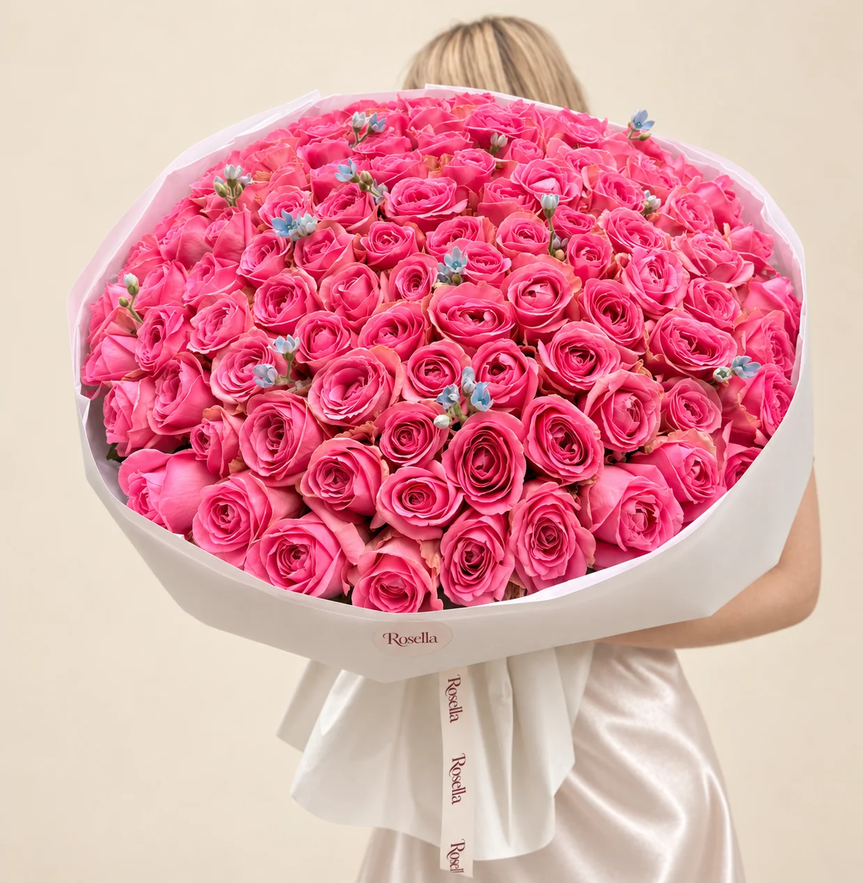 100 roses & 20 tweedia blooms in a hand-tied bouquet