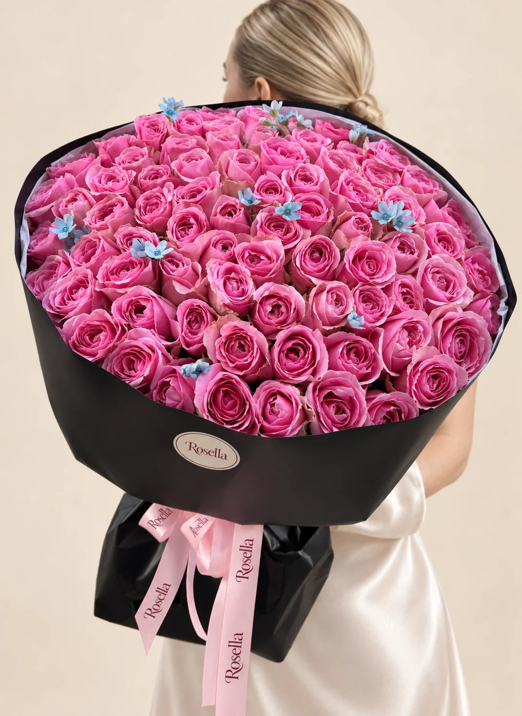 90 roses & 18 tweedia blooms in a hand-tied bouquet