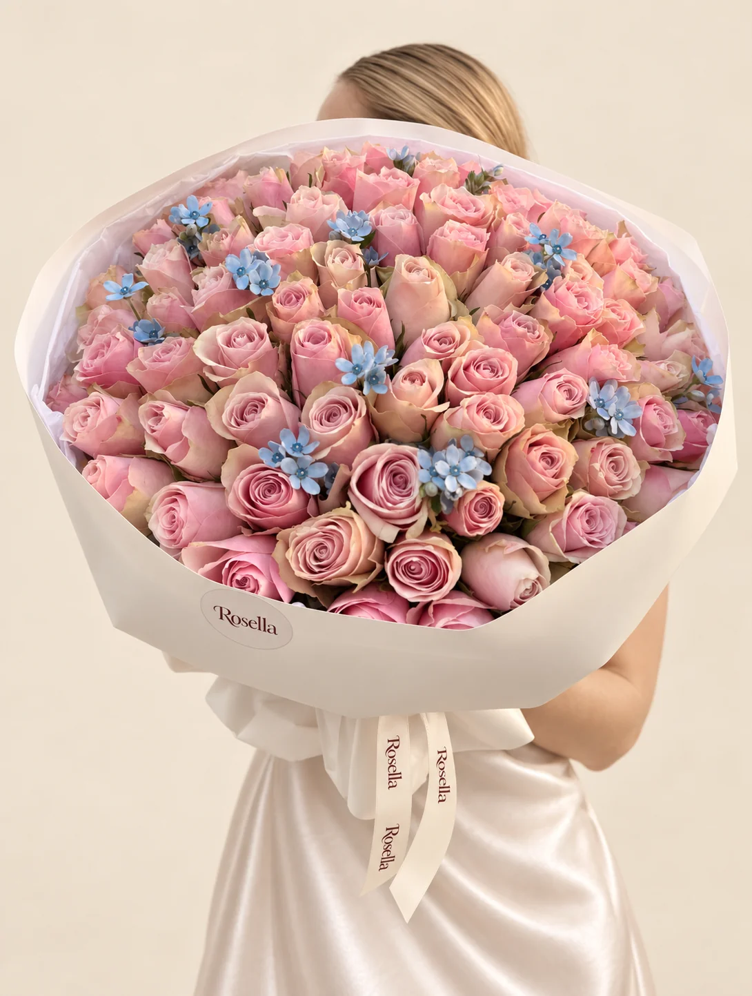 78 roses & 34 tweedia blooms in a hand-tied bouquet