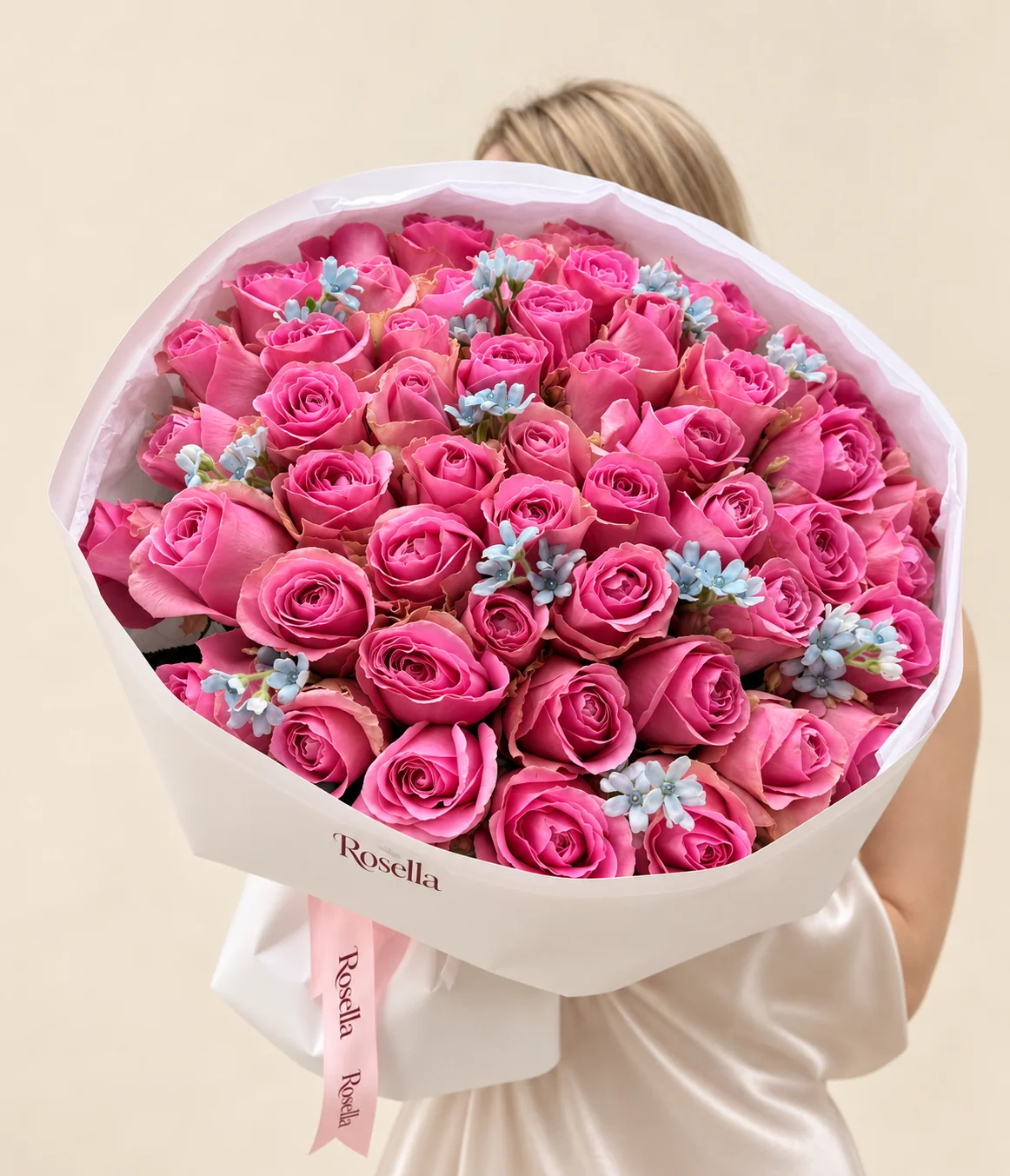 57 roses & 46 tweedia blooms in a hand-tied bouquet