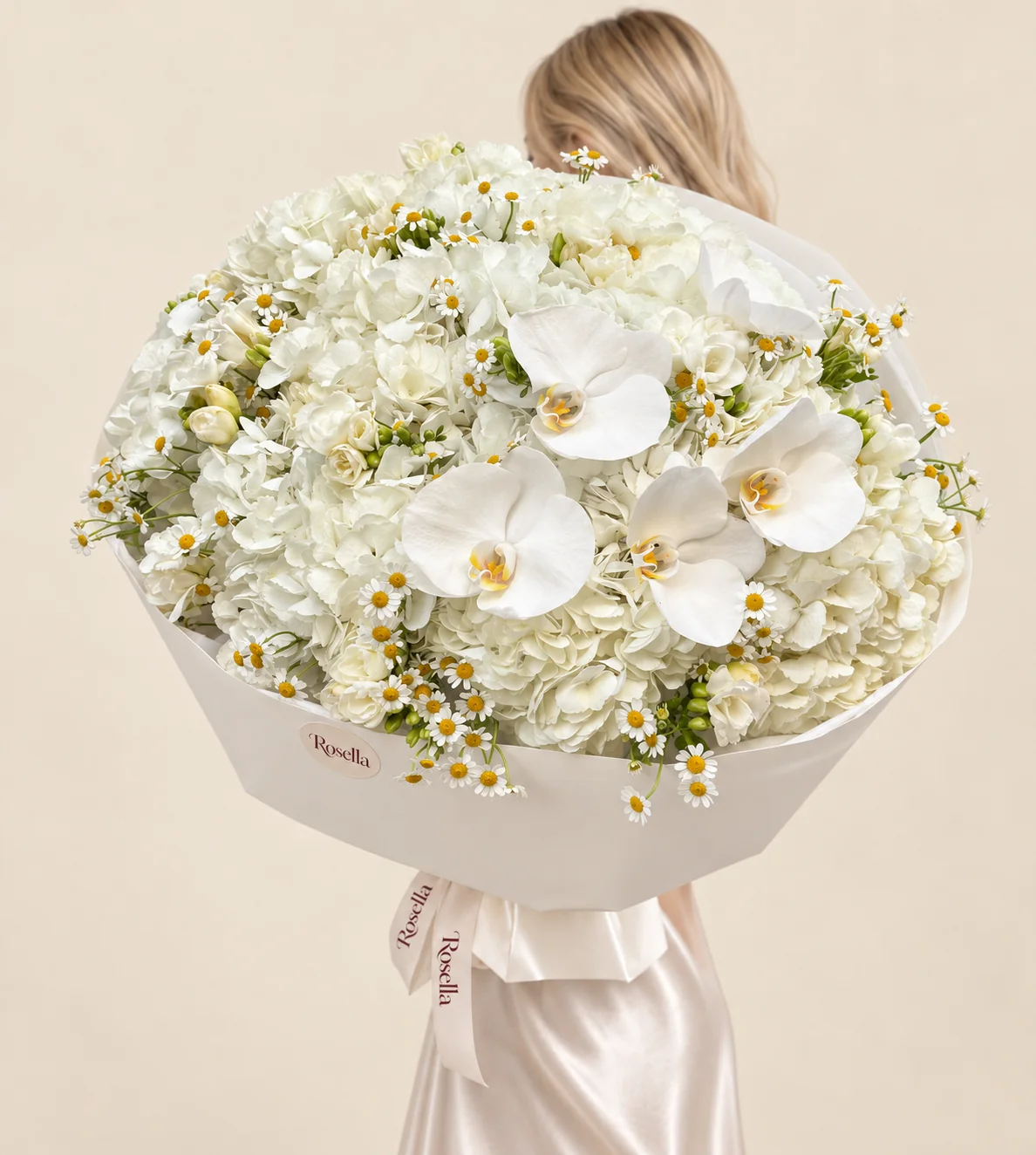 12 hydrangeas, 110 chamomile blooms, 7 freesias & 4 orchid blooms in a hand-tied bouquet