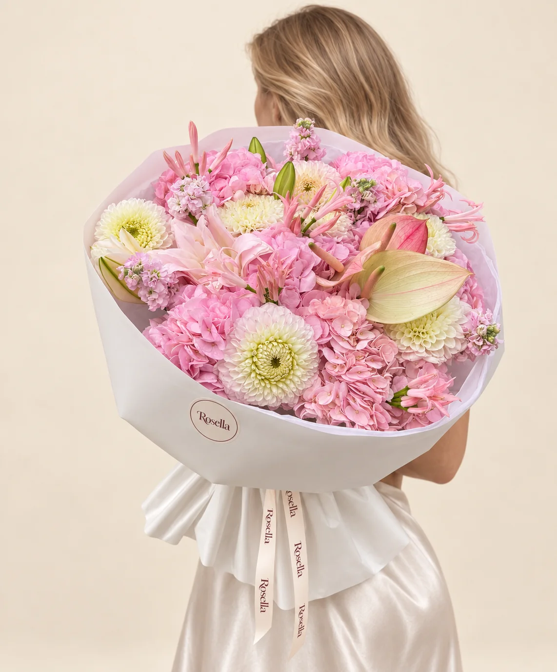 7 hydrangeas, 8 dahlias, 26 pink nerine, 4 stocks, 6 lily blooms, 2 pink anthuriums & 1 green anthurium in a hand-tied bouquet