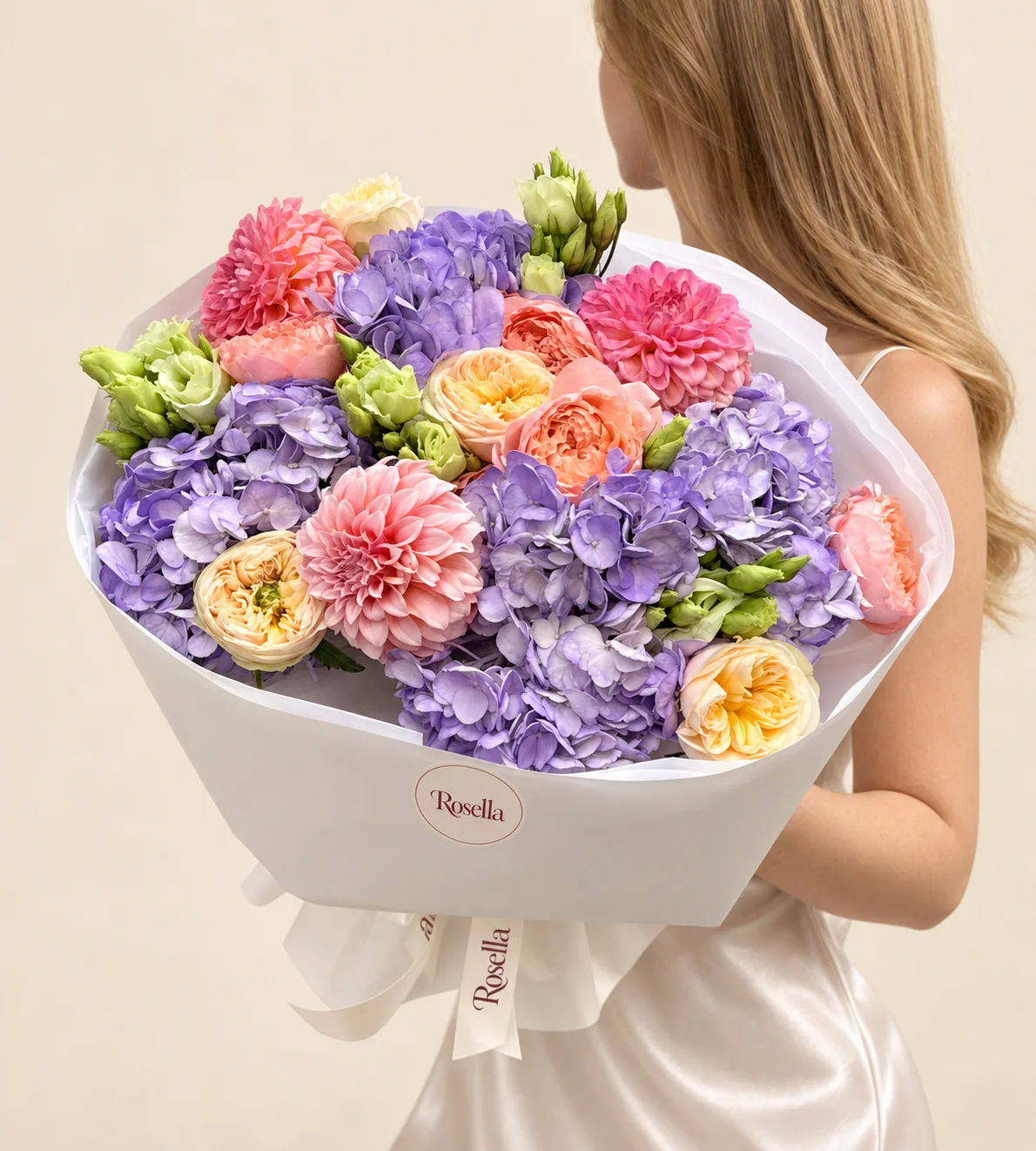 6 hydrangeas, 5 peach garden roses, 4 cream garden roses, 3 dahlias & 9 lisianthus blooms in a hand-tied bouquet