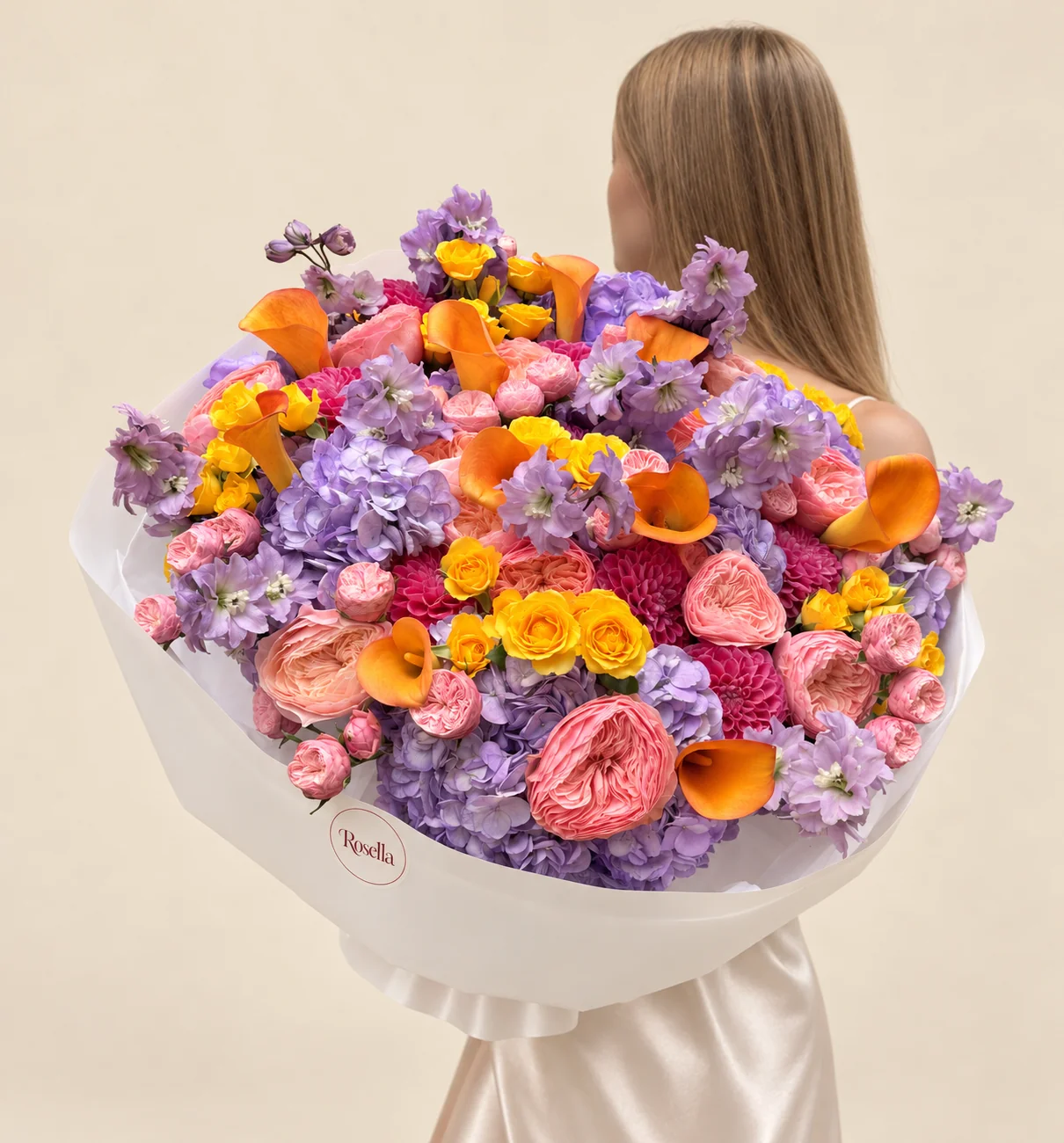 9 hydrangeas, 17 garden roses, 10 dahlias, 28 pink spray roses, 28 yellow spray roses, 3 delphiniums & 11 callas in a hand-tied bouquet