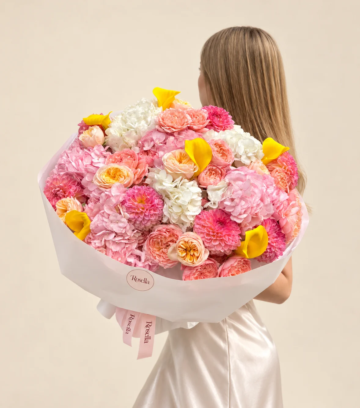 6 pink hydrangeas, 14 peach garden roses, 5 white hydrangeas, 9 cream garden roses, 9 dahlias & 6 callas in a hand-tied bouquet