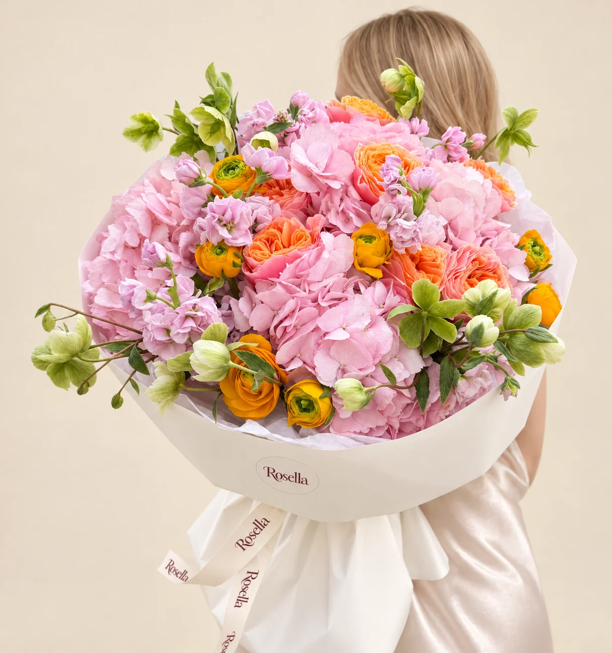 6 hydrangeas, 8 garden roses, 21 green helleborus, 8 ranunculus & 3 stocks in a hand-tied bouquet