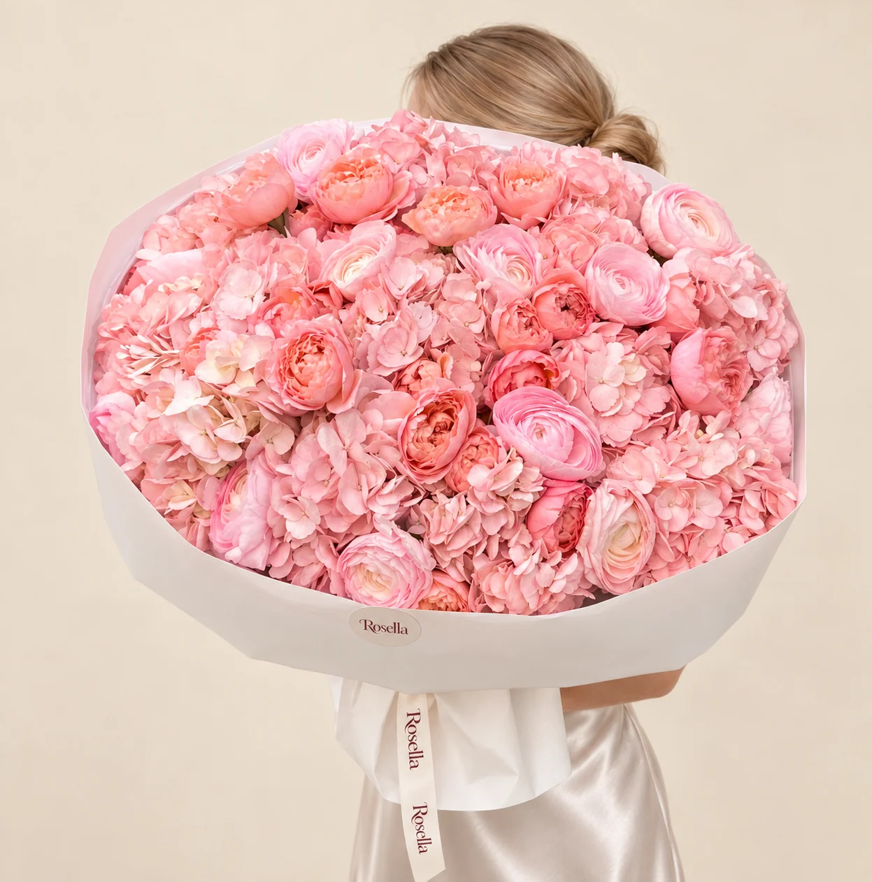 15 hydrangeas, 20 garden roses & 11 ranunculus blooms in a hand-tied bouquet