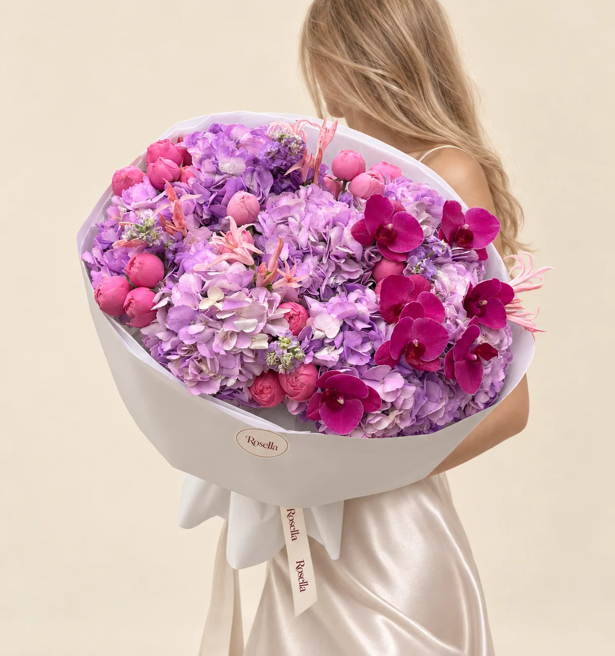 10 hydrangeas, 21 garden roses, 20 pale pink nerine, 7 orchid blooms & 2 stocks in a hand-tied bouquet
